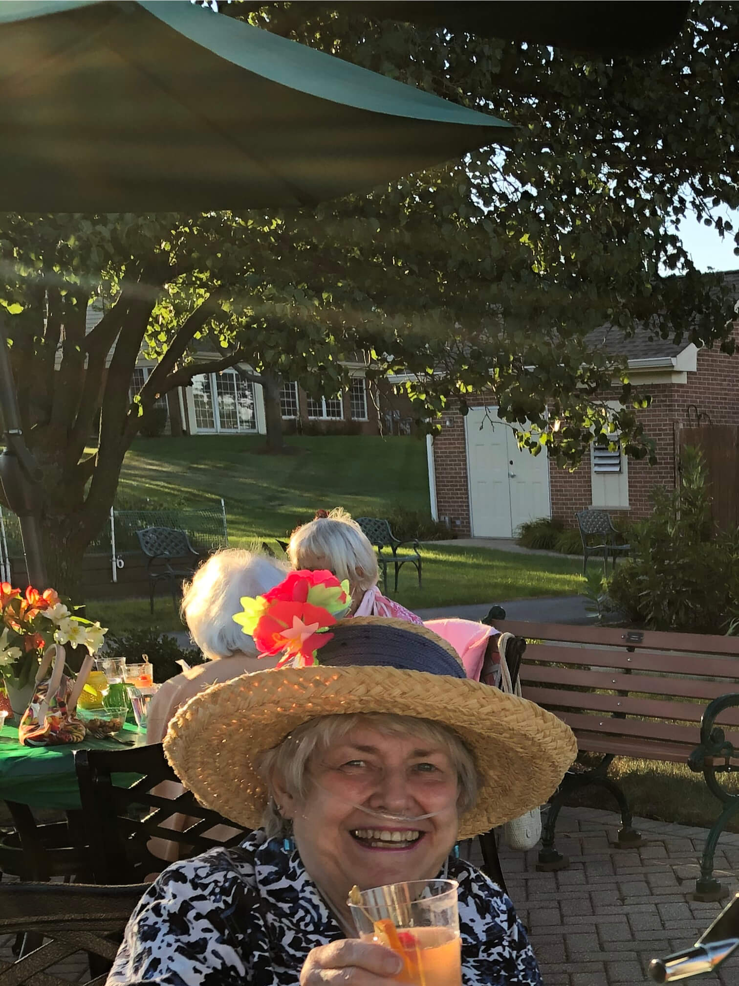 2775997 woman having a drink outside