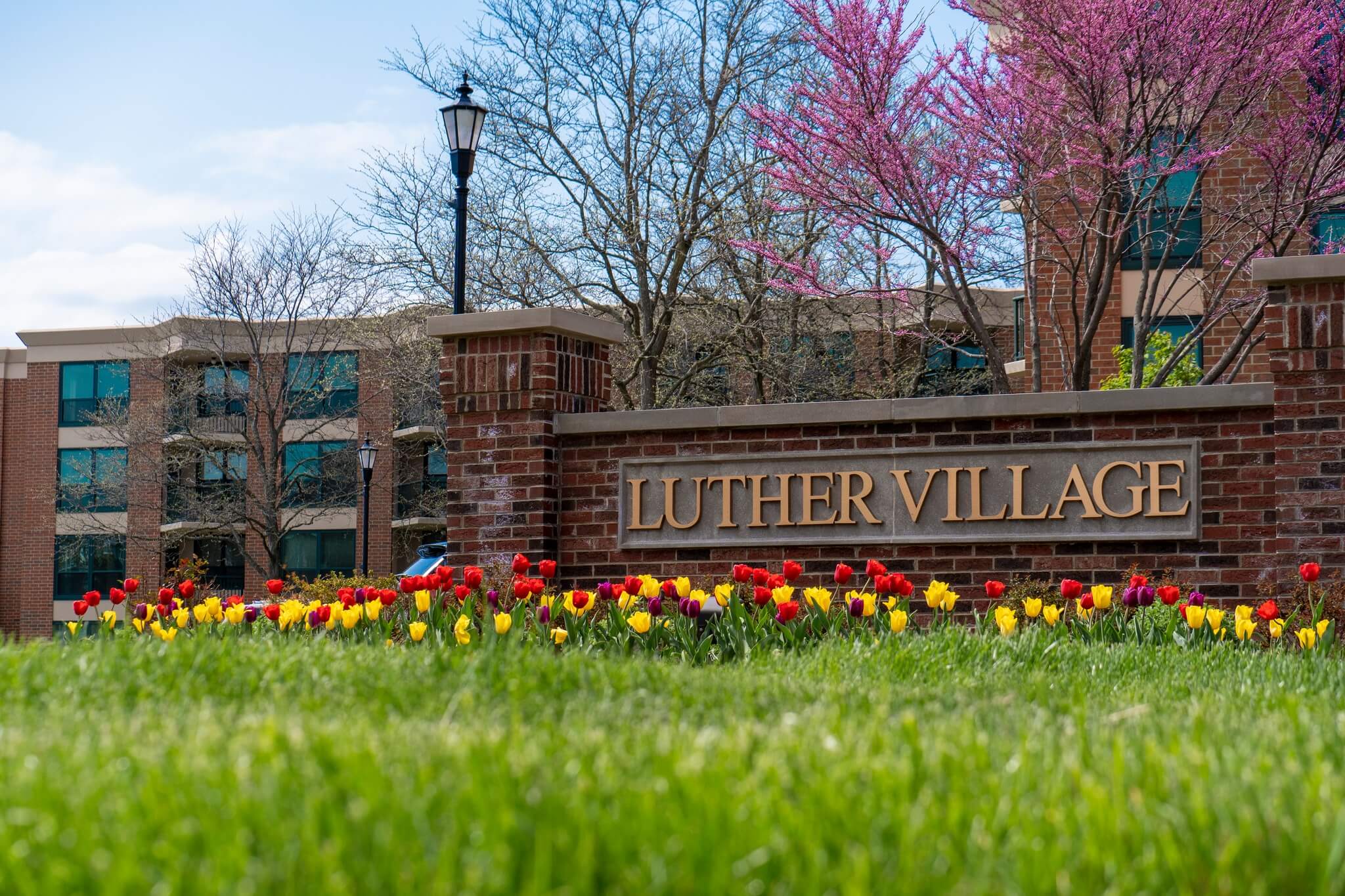 Luther Village entrance sign at spring time
