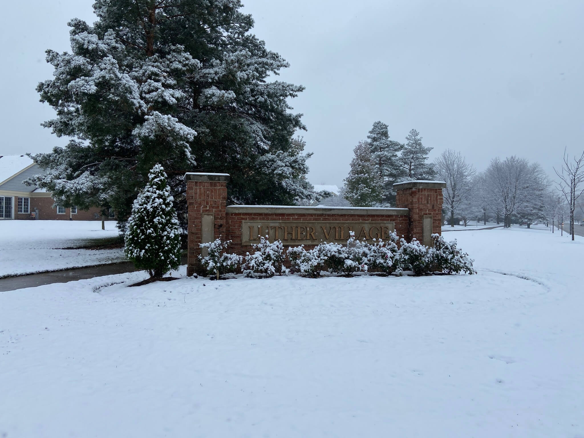 Luther Village sign in the snow